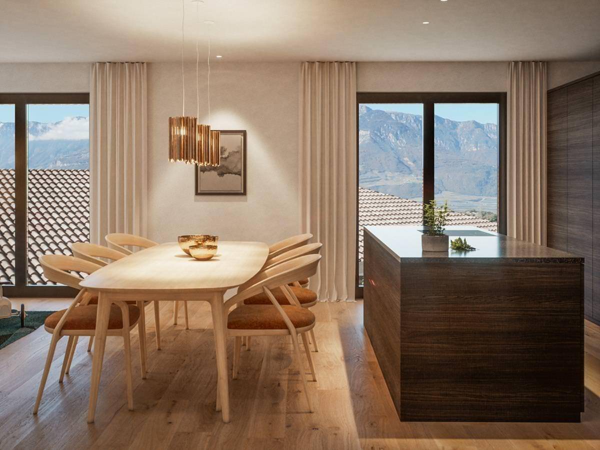 Eleganter Essbereich mit Holztisch und Stühlen, angrenzend an eine moderne Kücheninsel mit Bergblick.