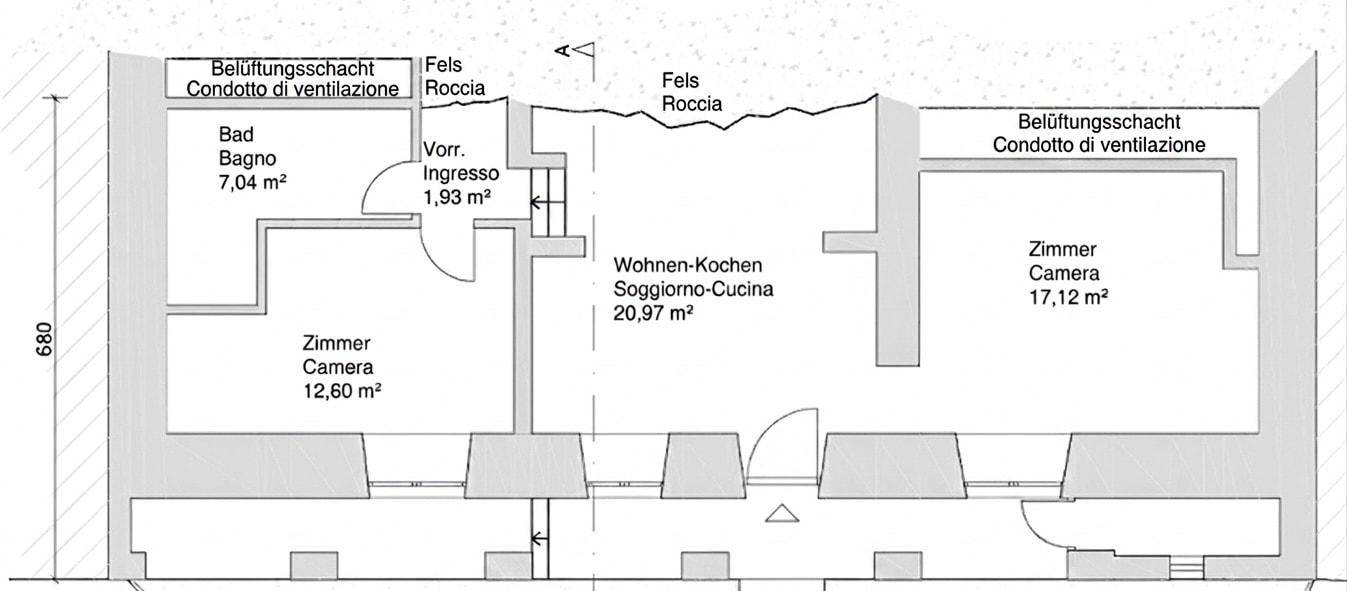 Grundriss einer Wohnung mit offenem Wohn-Kochbereich, einem Badezimmer und zwei weiteren Zimmern.