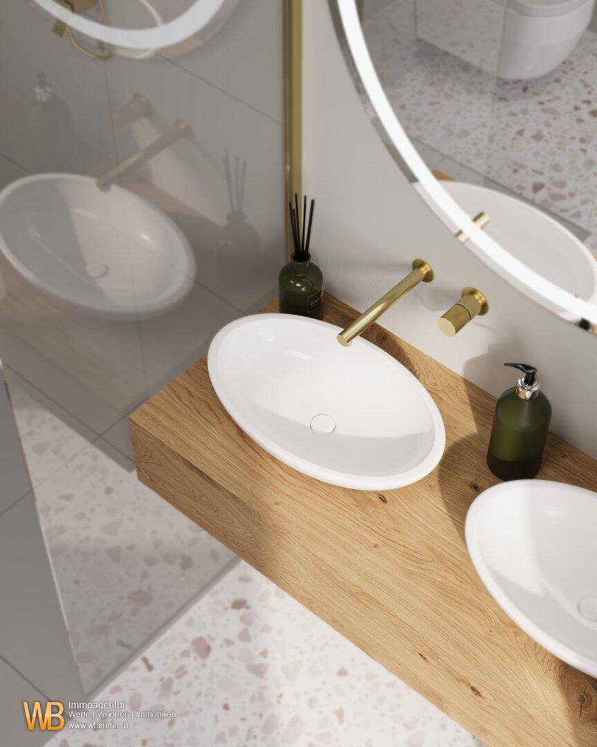 Detailansicht der modernen Doppelwaschbecken mit goldenen Armaturen und Holzunterschrank im Badezimmer.