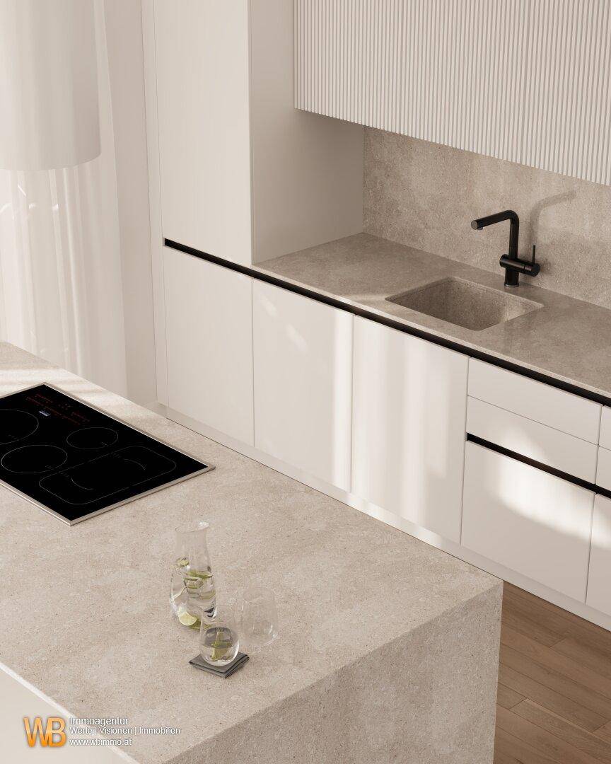 Moderne Küche mit Kochinsel, Induktionskochfeld und hellen Arbeitsplatten in minimalistischem Design.