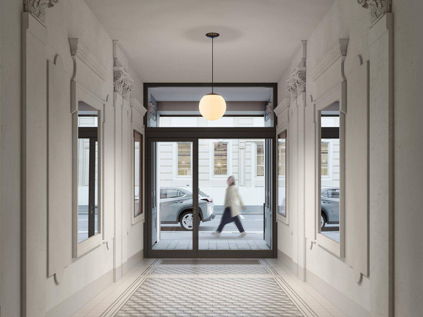 Heller Eingangsbereich mit hohen Decken, eleganten Fliesen und Blick zur Straße.