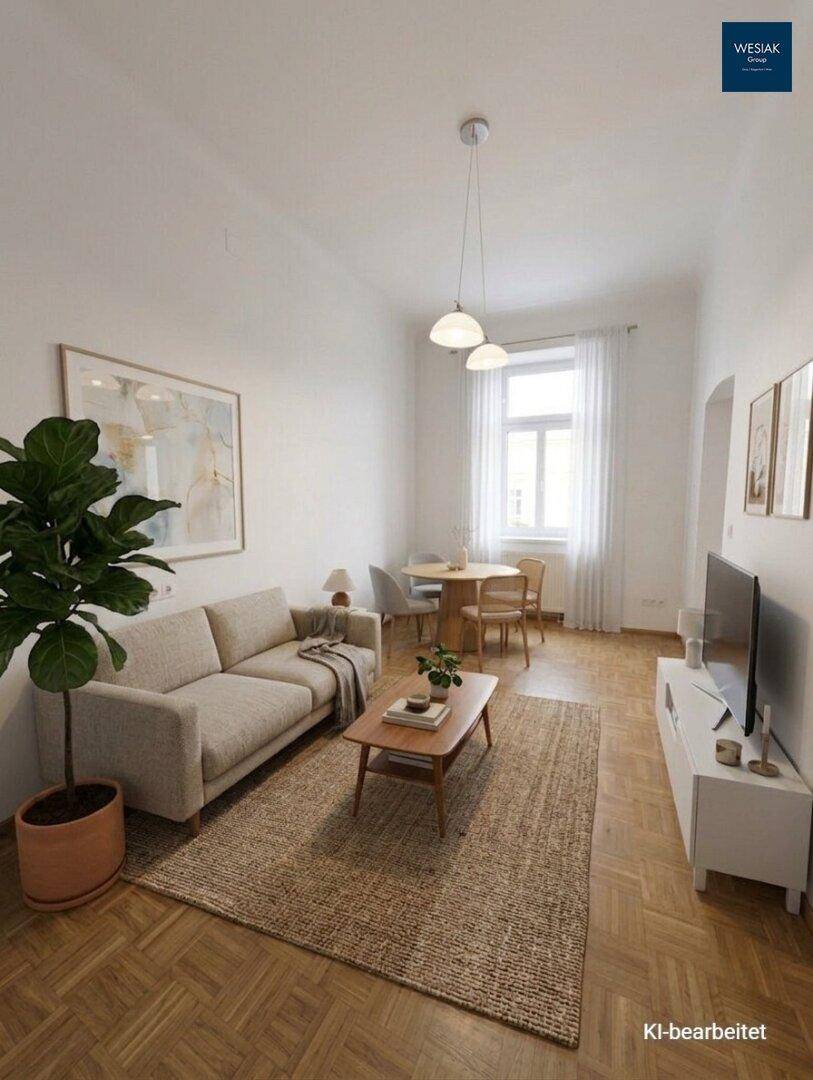 Gemütlicher Wohn- und Essbereich mit Parkettboden, Sofa und Esstisch am Fenster.