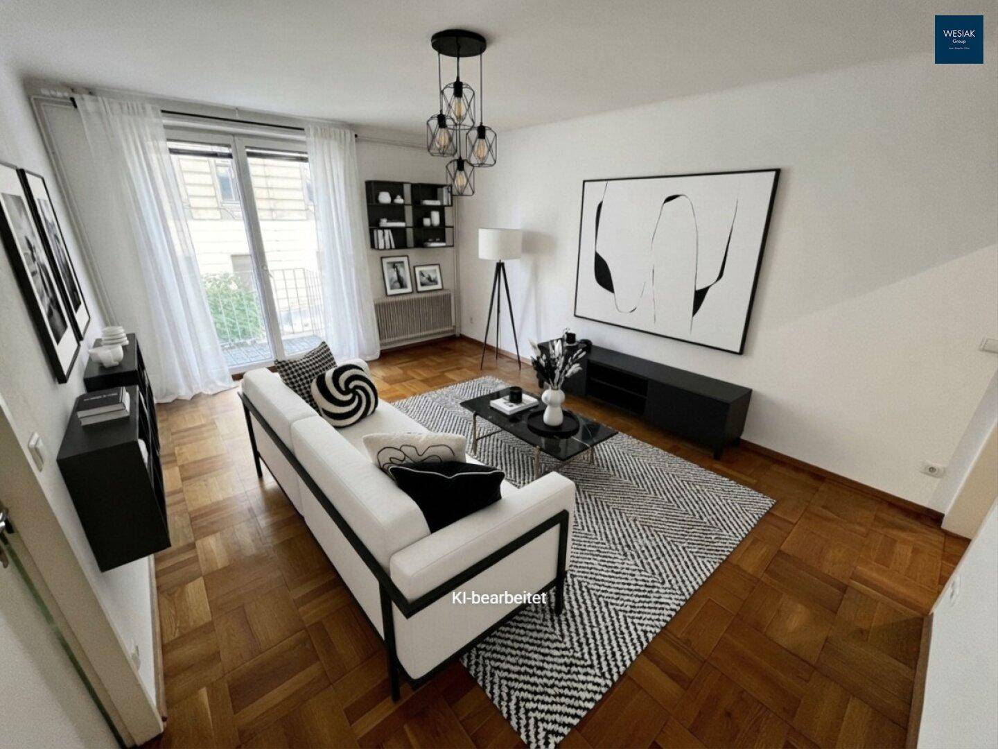 Modernes Wohnzimmer in Schwarz-Weiß mit Parkettboden und minimalistischer Einrichtung.