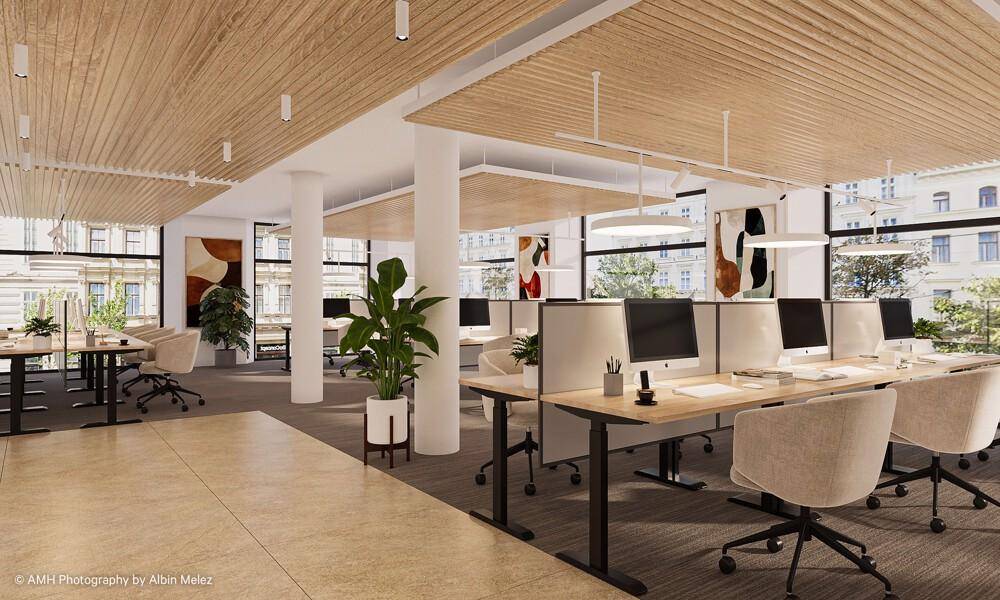 Modernes Großraumbüro mit ergonomischen Arbeitsplätzen, Holzakzenten an der Decke und großen Fenstern.