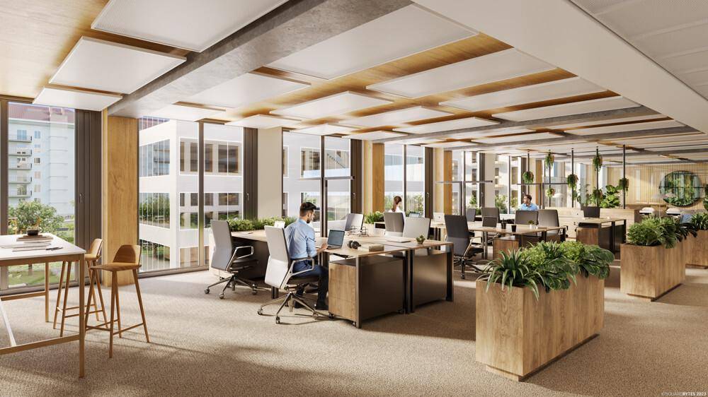 Geräumiger Großraumbüro mit ergonomischen Arbeitsplätzen, Pflanzen und weitem Ausblick.