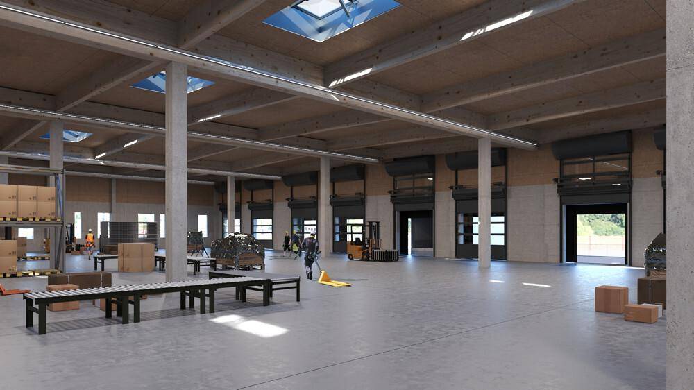 Geräumige Lagerhalle mit hohen Decken, Betonboden und großen Rolltoren für den Zugang.