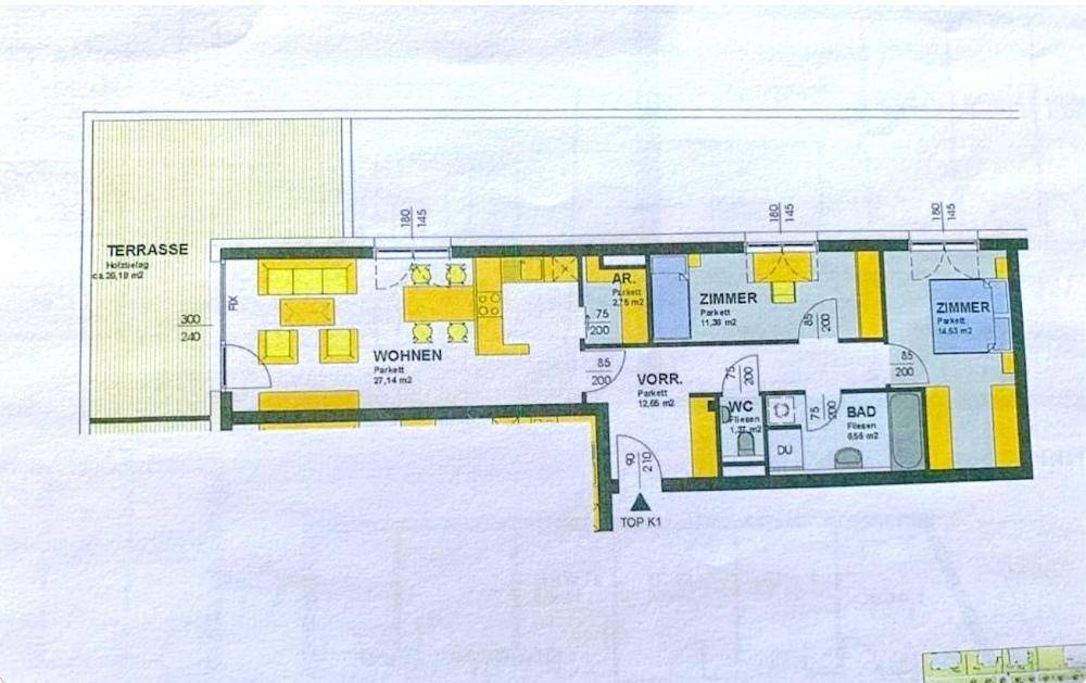 Detaillierter Grundriss einer Wohnung mit Terrasse, Wohnbereich, Küche und zwei Schlafzimmern.