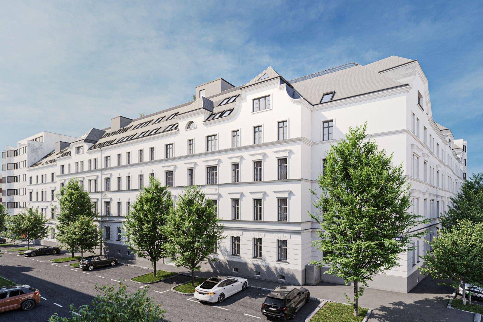 Moderne Wohngebäude-Fassade mit vielen Fenstern und gepflegter Außenanlage.