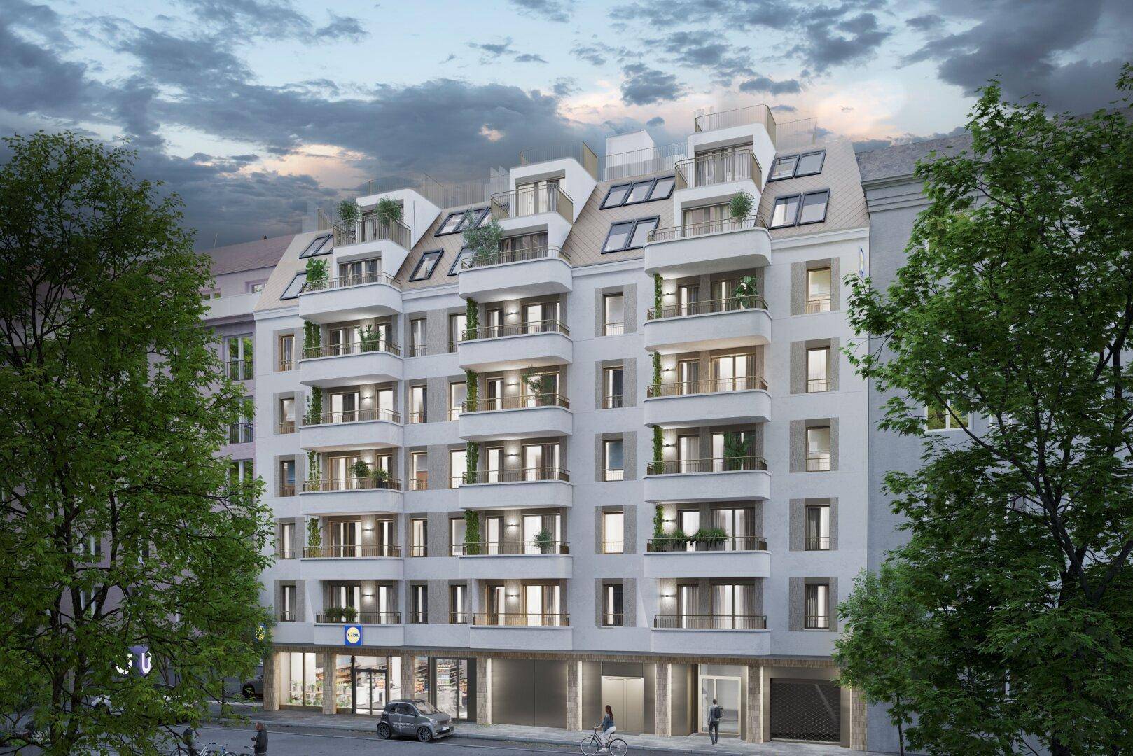 Moderne Wohnhausfassade mit zahlreichen Balkonen und großen Fenstern in urbaner Umgebung.