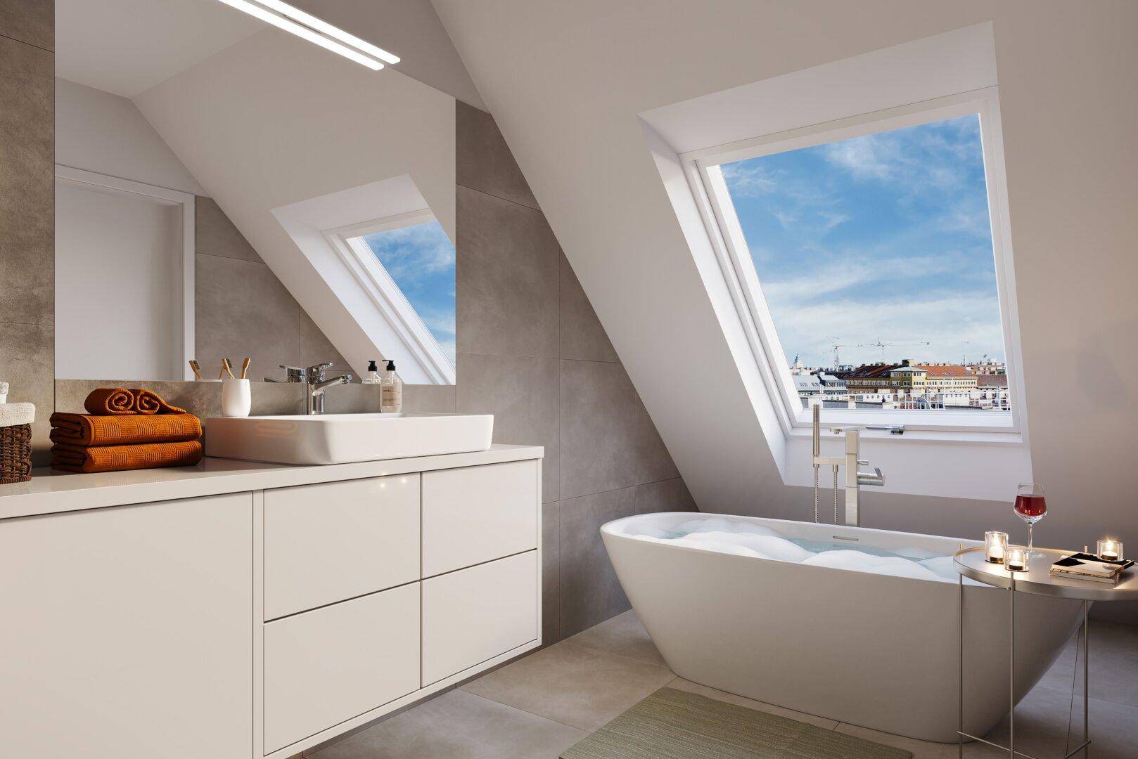 Modernes Badezimmer im Dachgeschoss mit freistehender Badewanne unter einem großen Dachfenster.