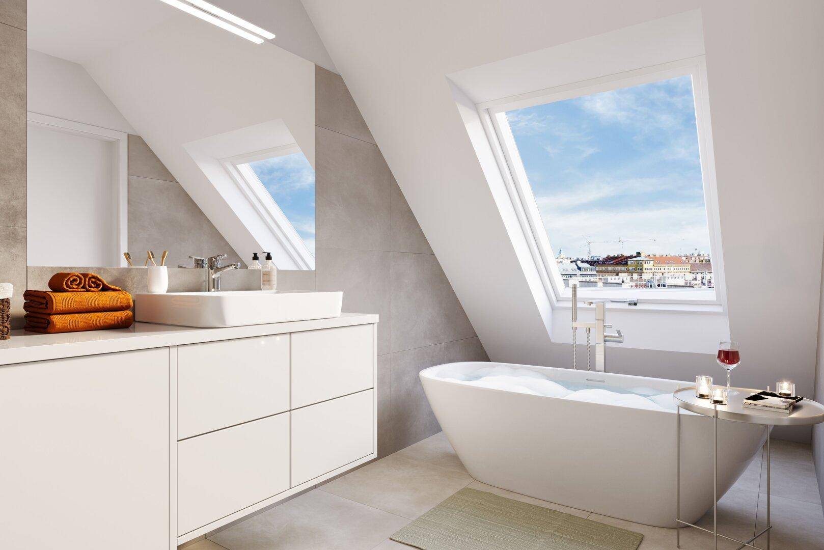 Modernes Badezimmer im Dachgeschoss mit freistehender Badewanne und großem Dachfenster.