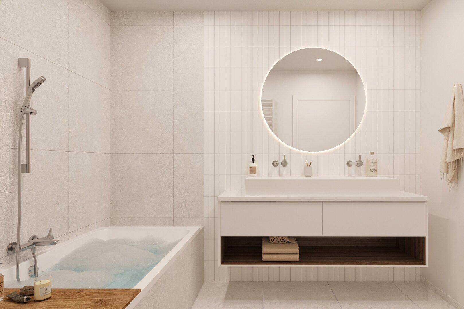 Modernes Badezimmer mit Badewanne, elegantem Waschtisch und beleuchtetem Rundspiegel.