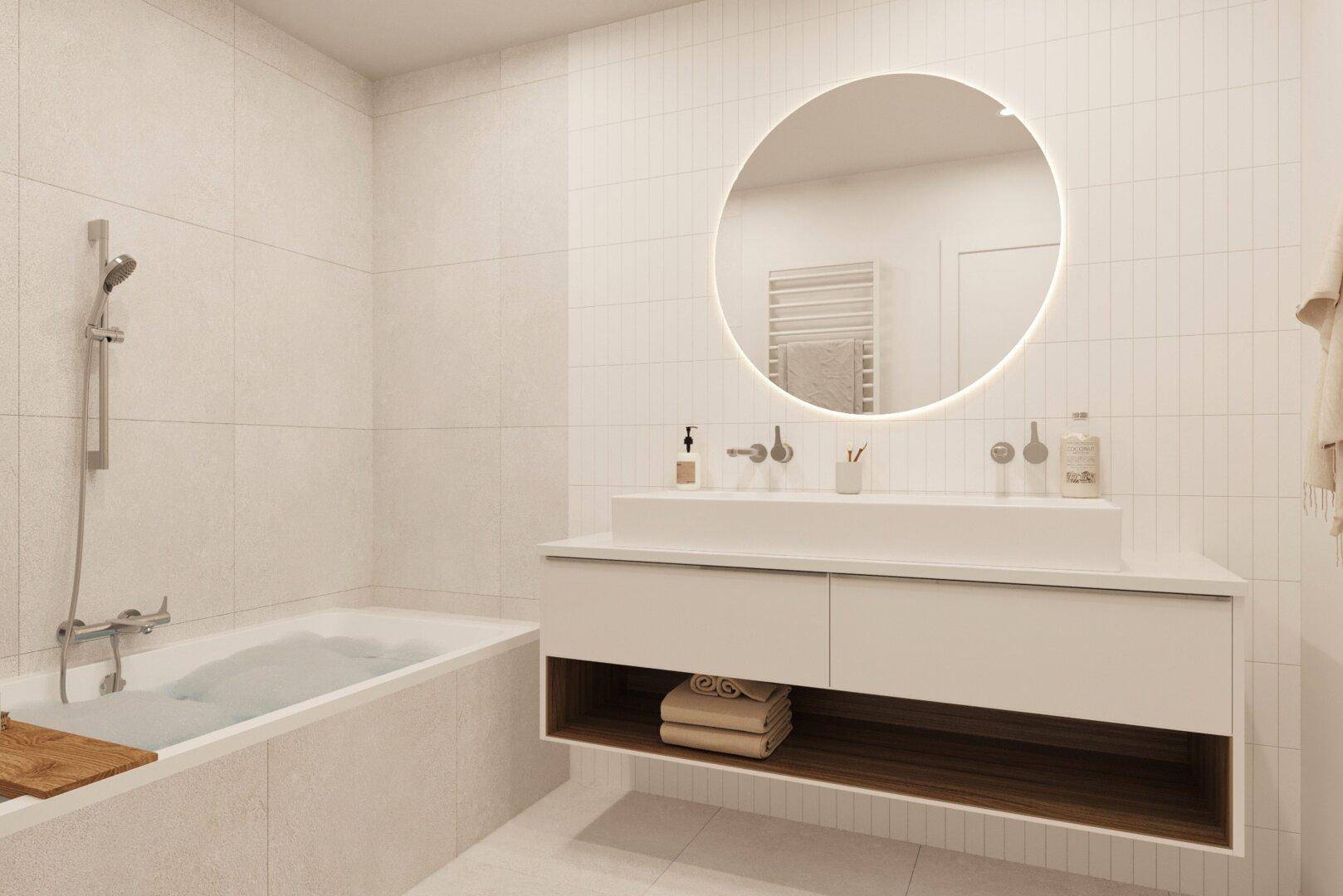 Modernes Badezimmer mit Badewanne, schwebendem Waschtisch und beleuchtetem Rundspiegel.