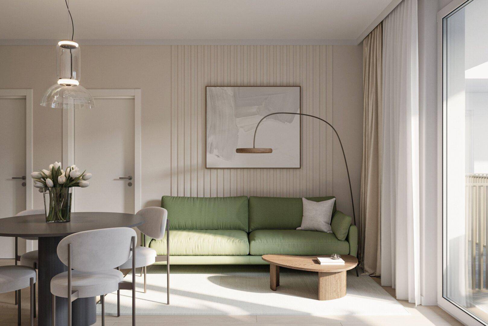 Gemütlicher Wohnbereich mit grünem Sofa, Esstisch und viel Tageslicht durch große Fenster.