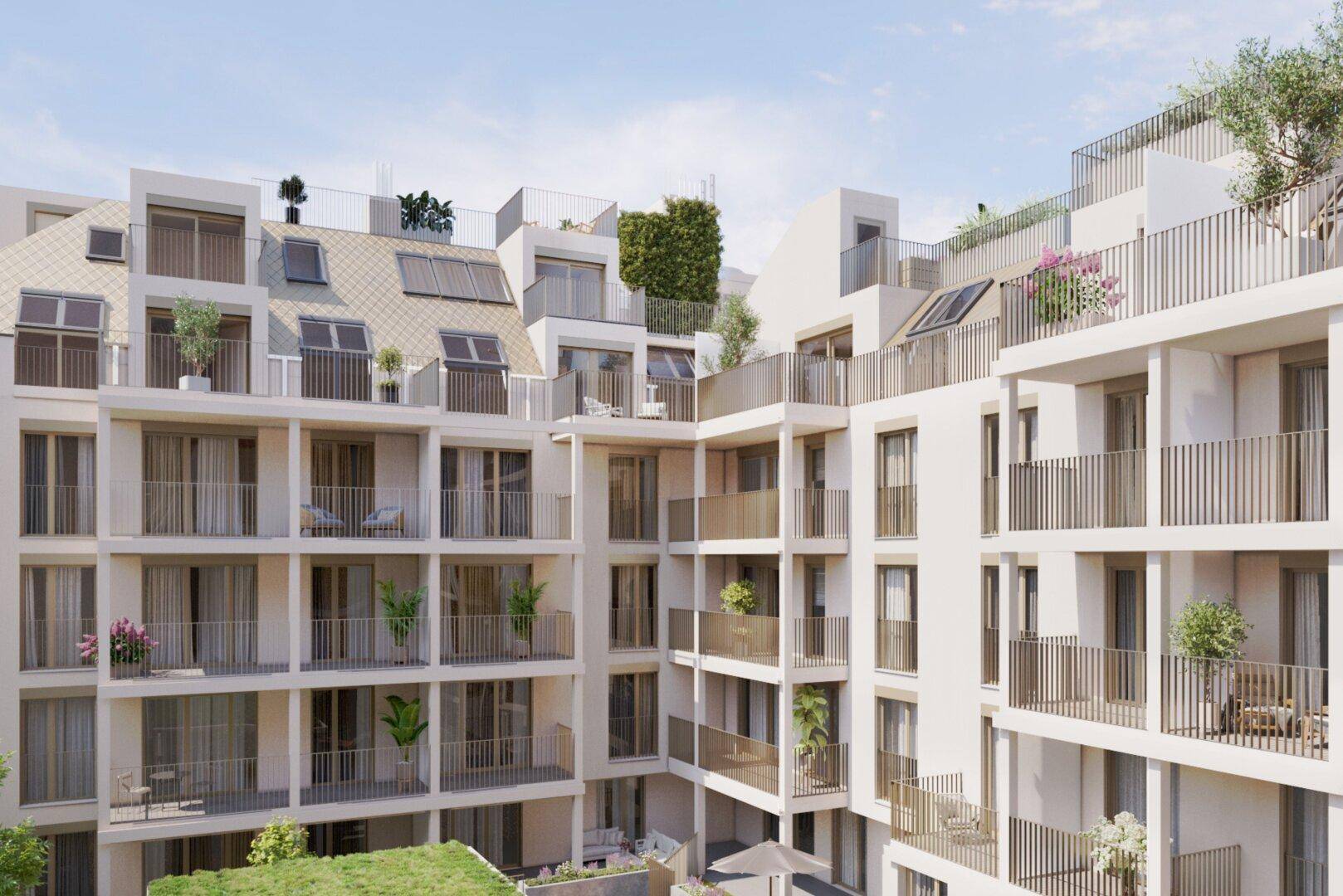 Moderne Wohnanlage mit zahlreichen Balkonen, Dachterrassen und begrünten Fassaden im Innenhof.