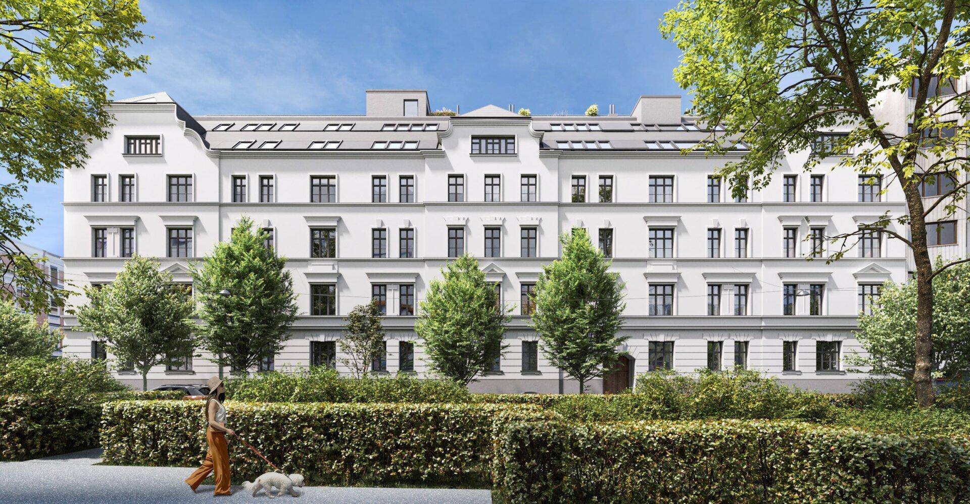 Elegante weiße Fassade eines Wohngebäudes umgeben von gepflegten Hecken und Bäumen.