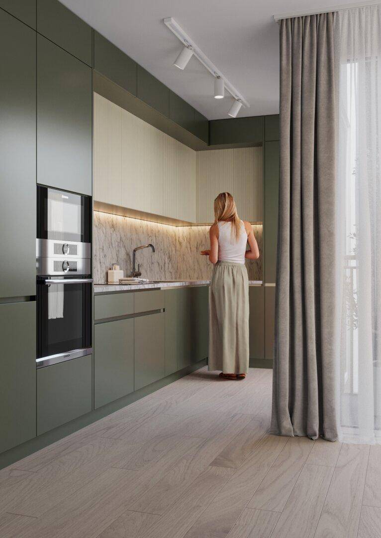 Moderne Küche in Grüntönen mit integrierten Geräten und Holzoptikboden.