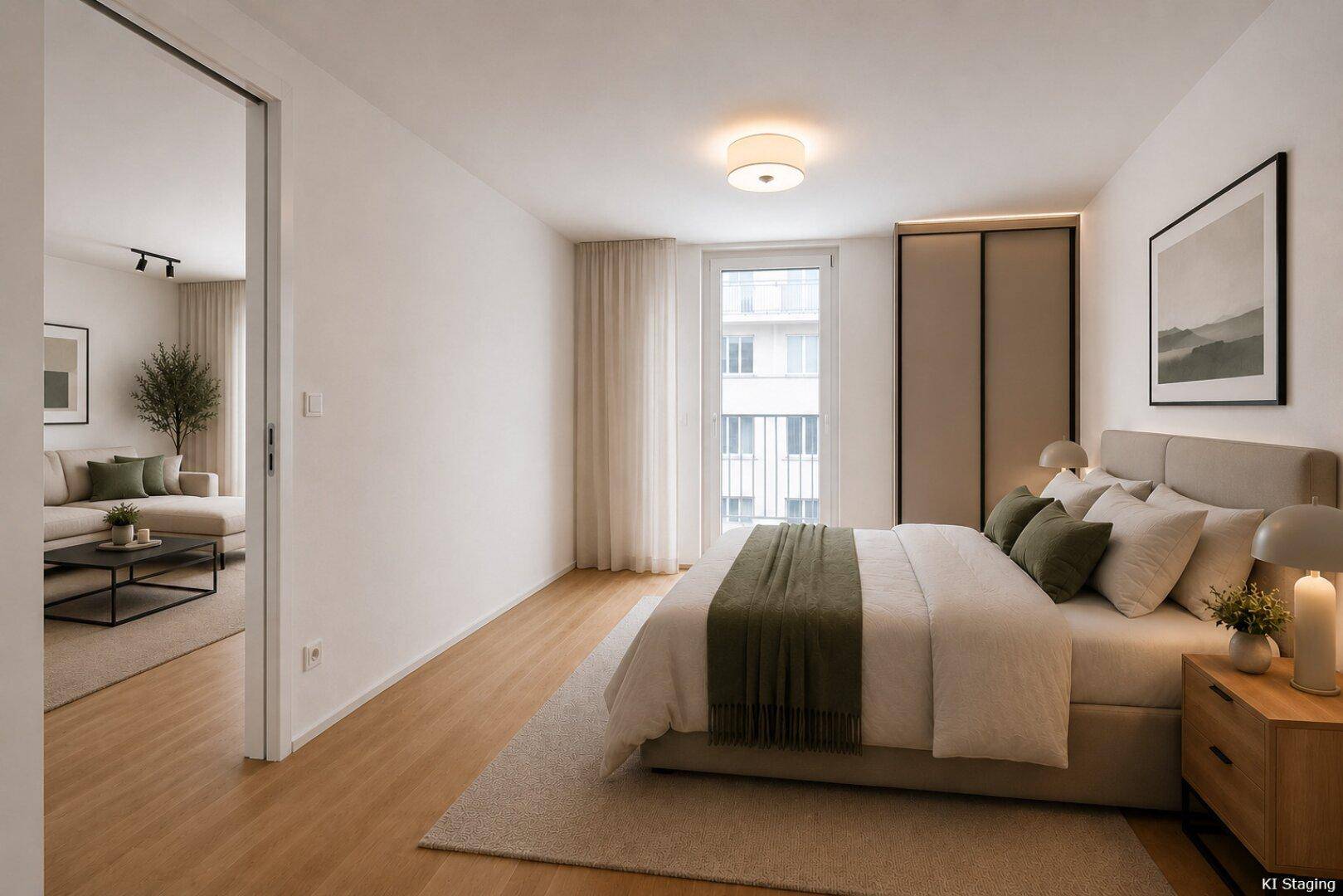 Helles Schlafzimmer mit Holzboden, modernem Bett und Blick in den angrenzenden Wohnbereich.