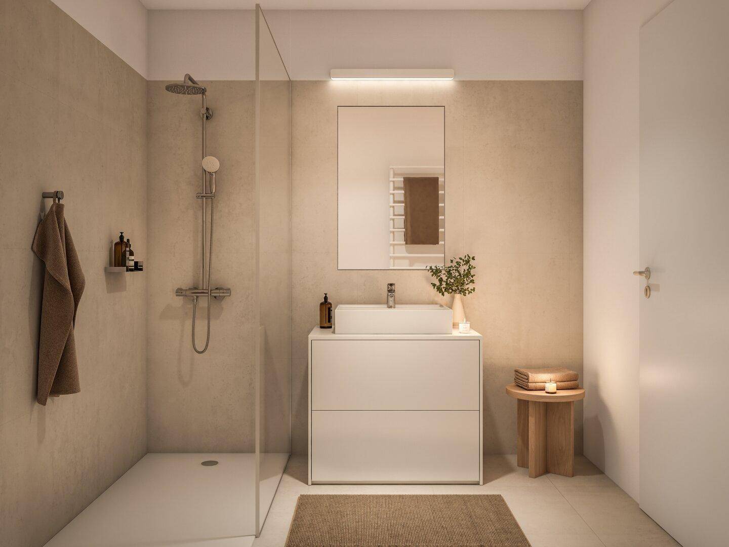 Modernes Badezimmer mit ebenerdiger Dusche, weißem Waschtisch und beheiztem Handtuchhalter.