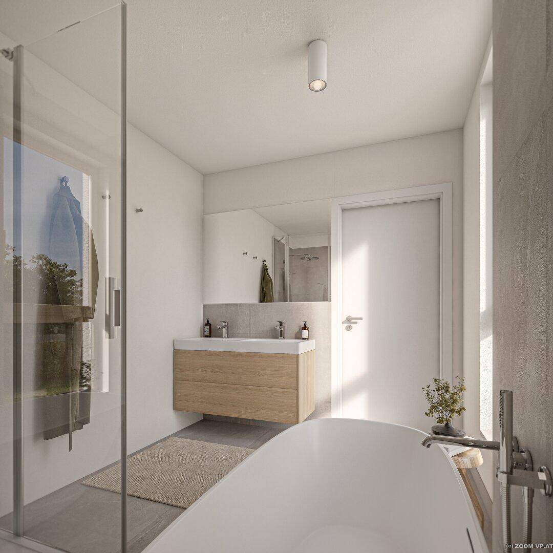 Helles Badezimmer mit moderner Dusche, Waschtisch und großem Spiegel.