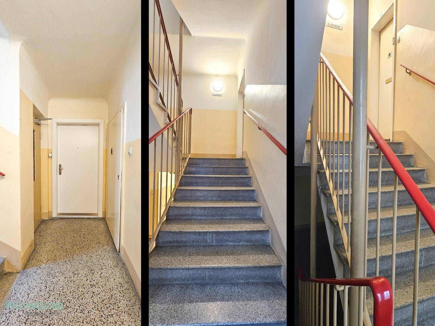 Treppenhaus und Flur eines Mehrfamilienhauses mit Terrazzoboden und rotem Geländer.