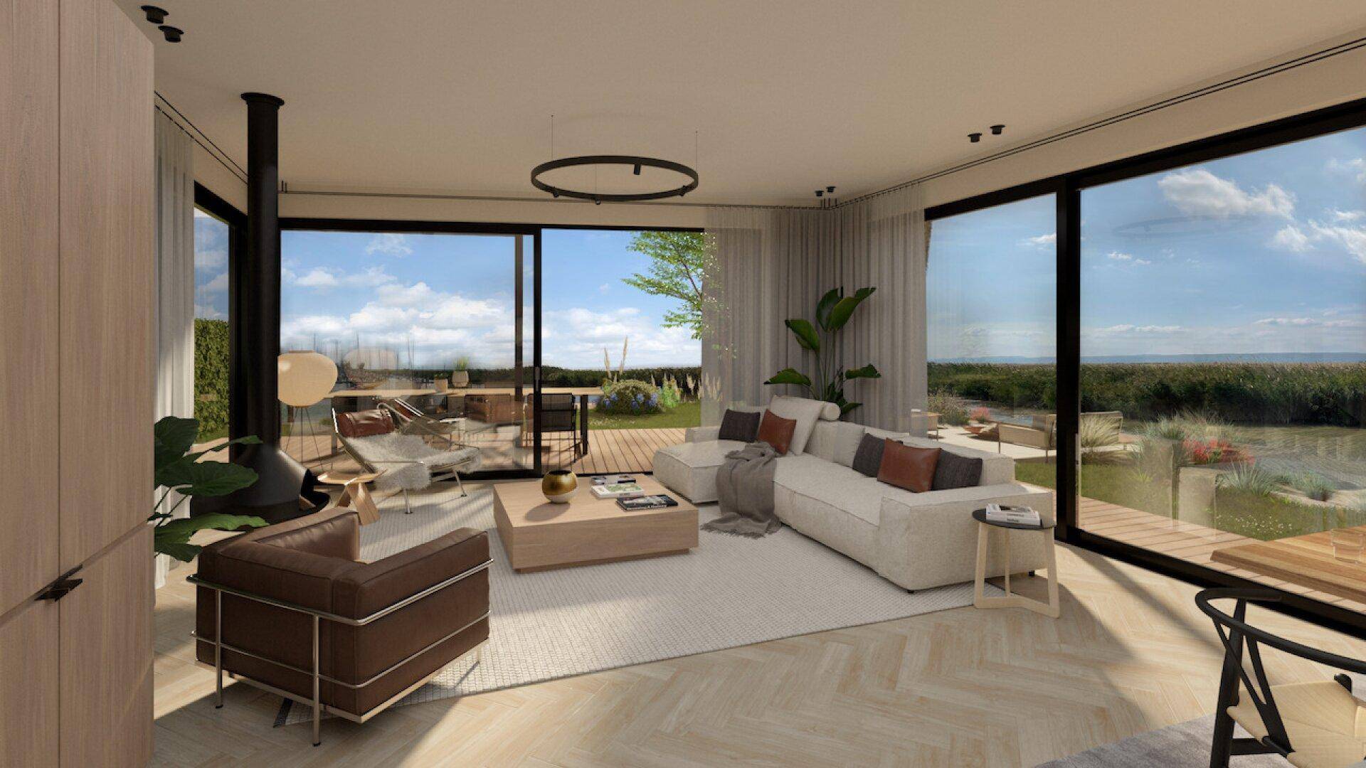 Helles Wohnzimmer mit großen Schiebetüren, die Zugang zur Terrasse und zum Garten bieten.