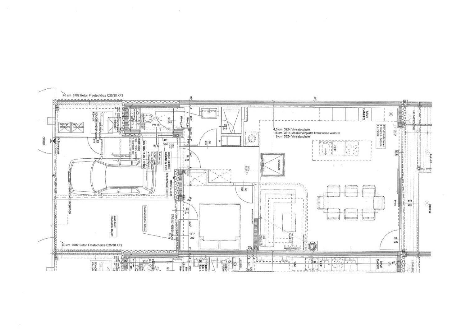 Detaillierter Grundriss einer Wohneinheit mit offenem Wohnbereich und integrierter Garage.