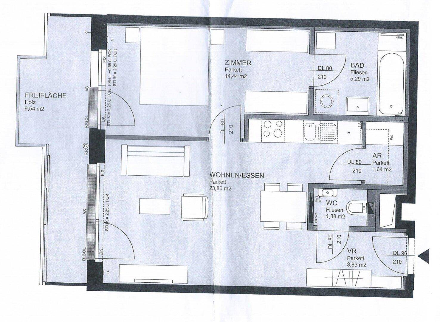 Detaillierter Grundriss einer Wohnung mit Schlafzimmer, offenem Wohn-Essbereich und Freifläche.