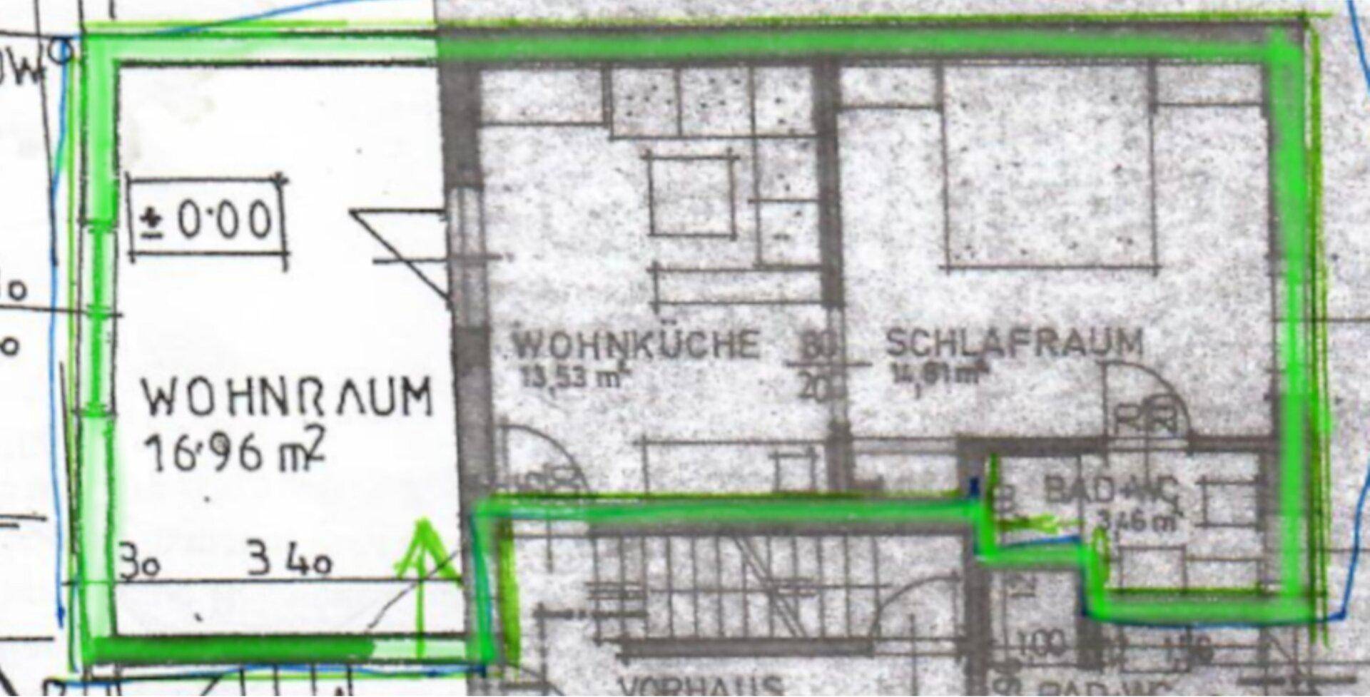Grundriss mit hervorgehobenen Bereichen für Wohnküche, Schlafzimmer und Badezimmer.