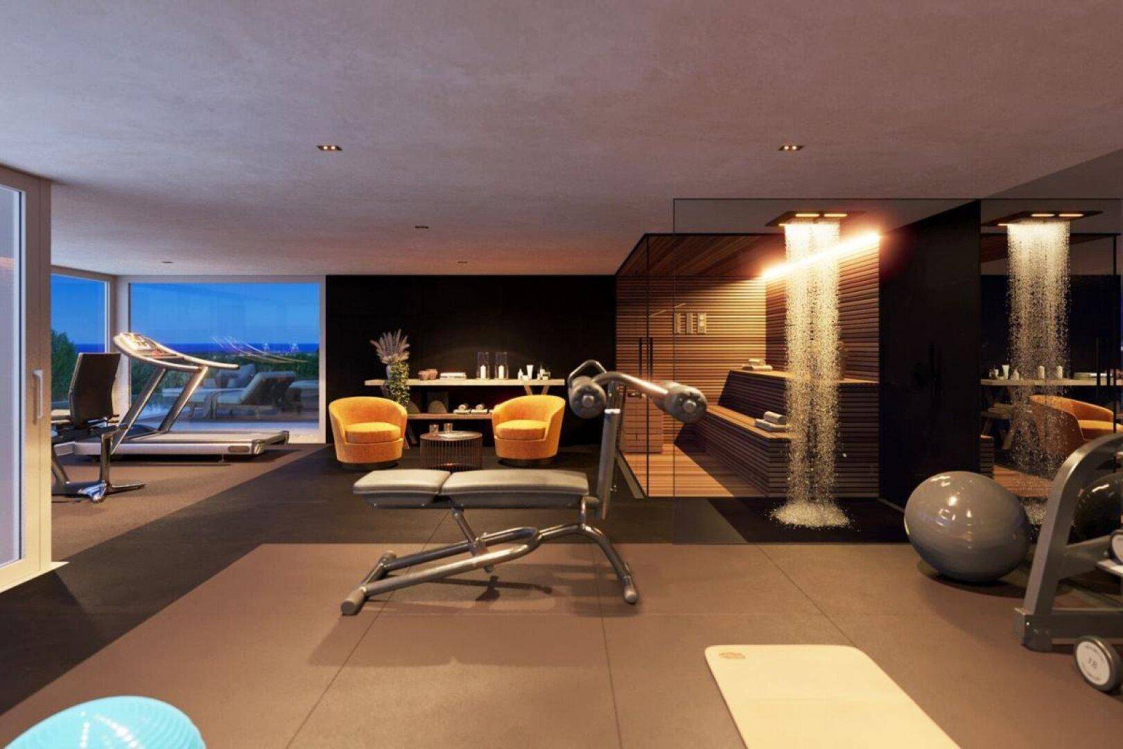 Fitnessraum mit modernen Geräten, Entspannungsbereich und zwei integrierten Erlebnisduschen.