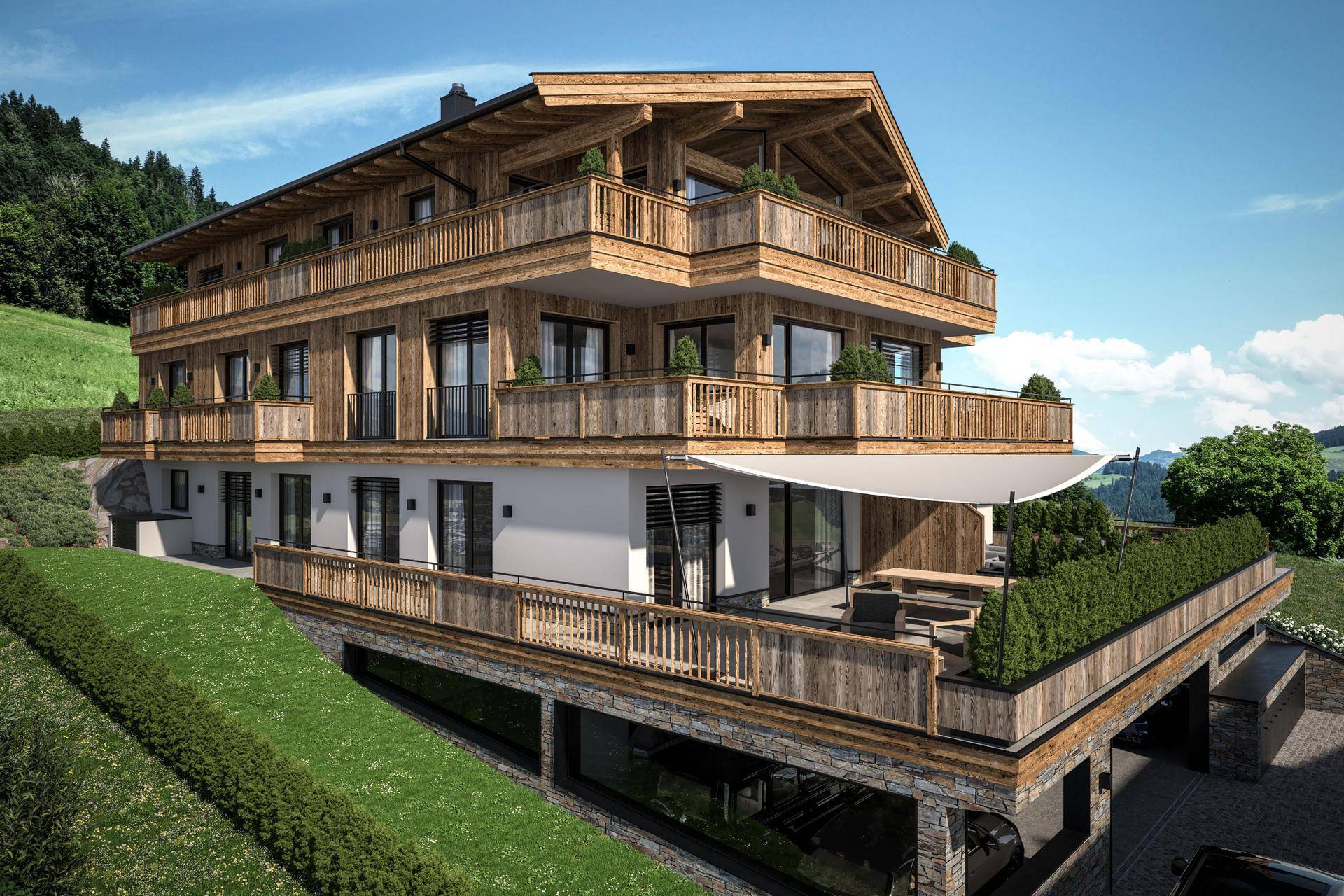 Modernes Chalet mit Holzfassade, mehreren Balkonen und Terrassen in alpiner Hanglage.