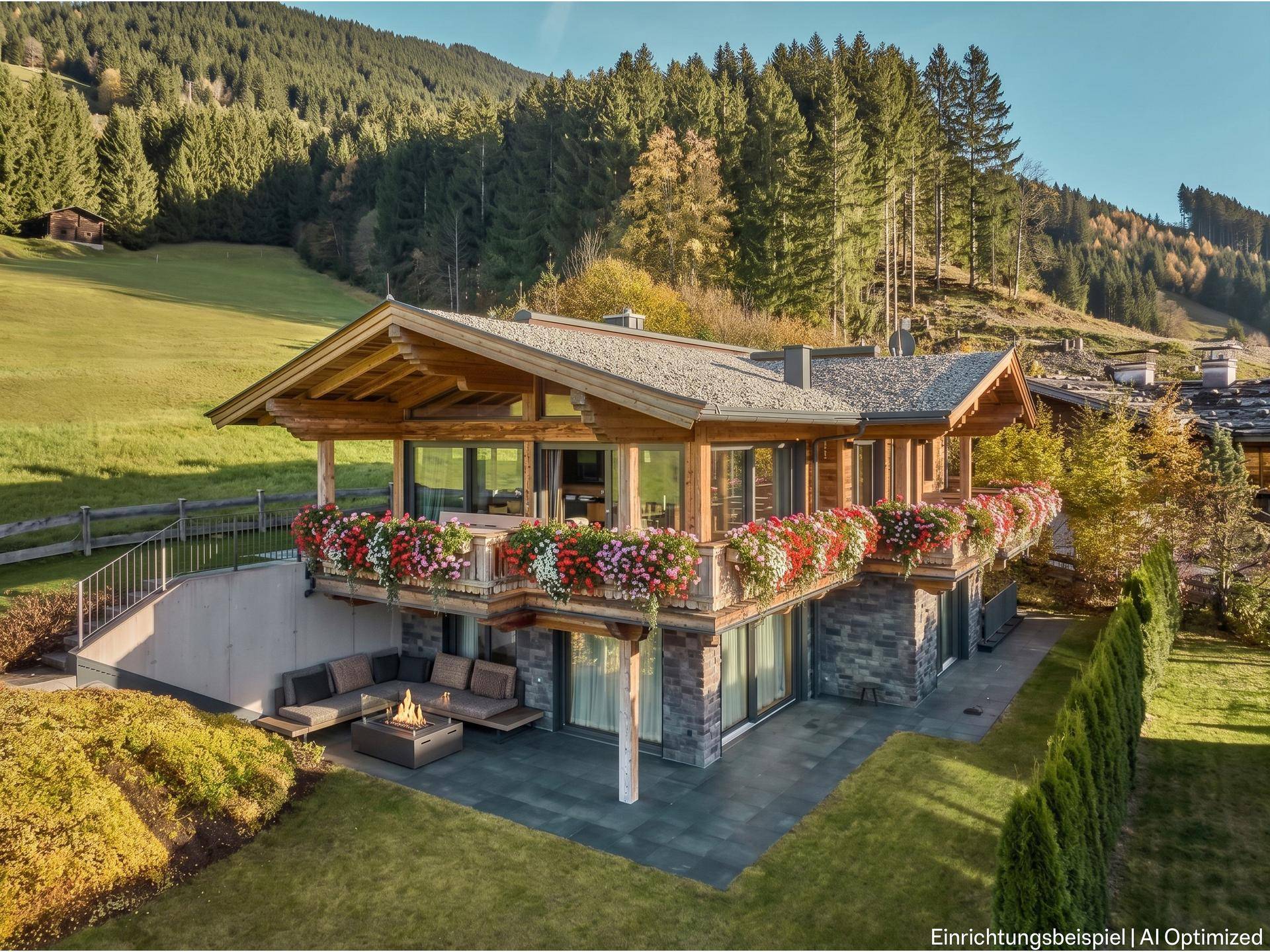 Charmantes Chalet mit blumengeschmückten Balkonen, großzügiger Terrasse und gepflegtem Gartenbereich.