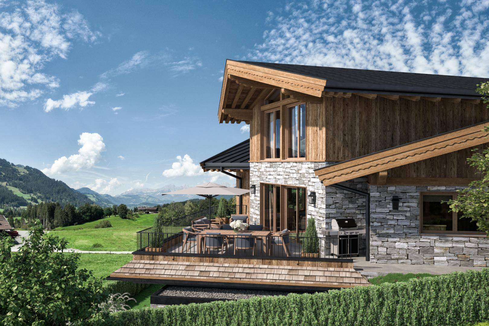 Große Holzterrasse mit Essbereich und Grill, umgeben von alpiner Landschaft und Bergblick.