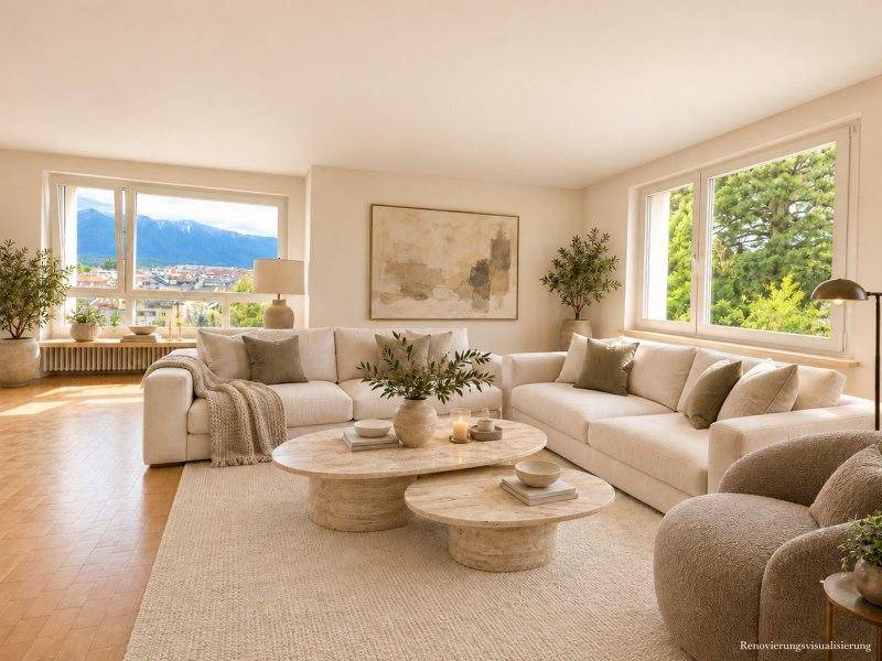 Gemütliches Wohnzimmer mit zwei großen Sofas, stilvollen Couchtischen und Panoramablick.
