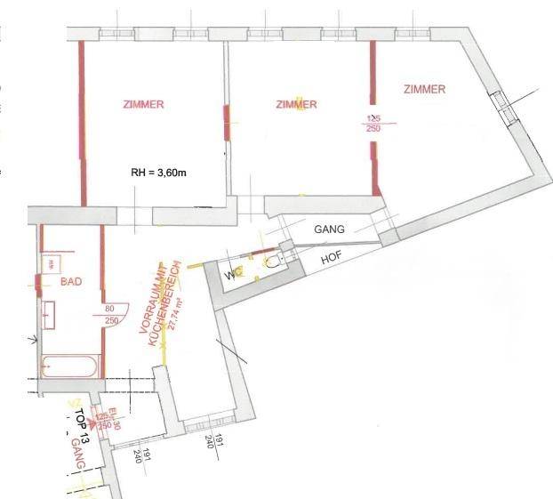 Grundrissplan einer Wohnung mit drei Zimmern, Bad, WC und Küchenbereich.