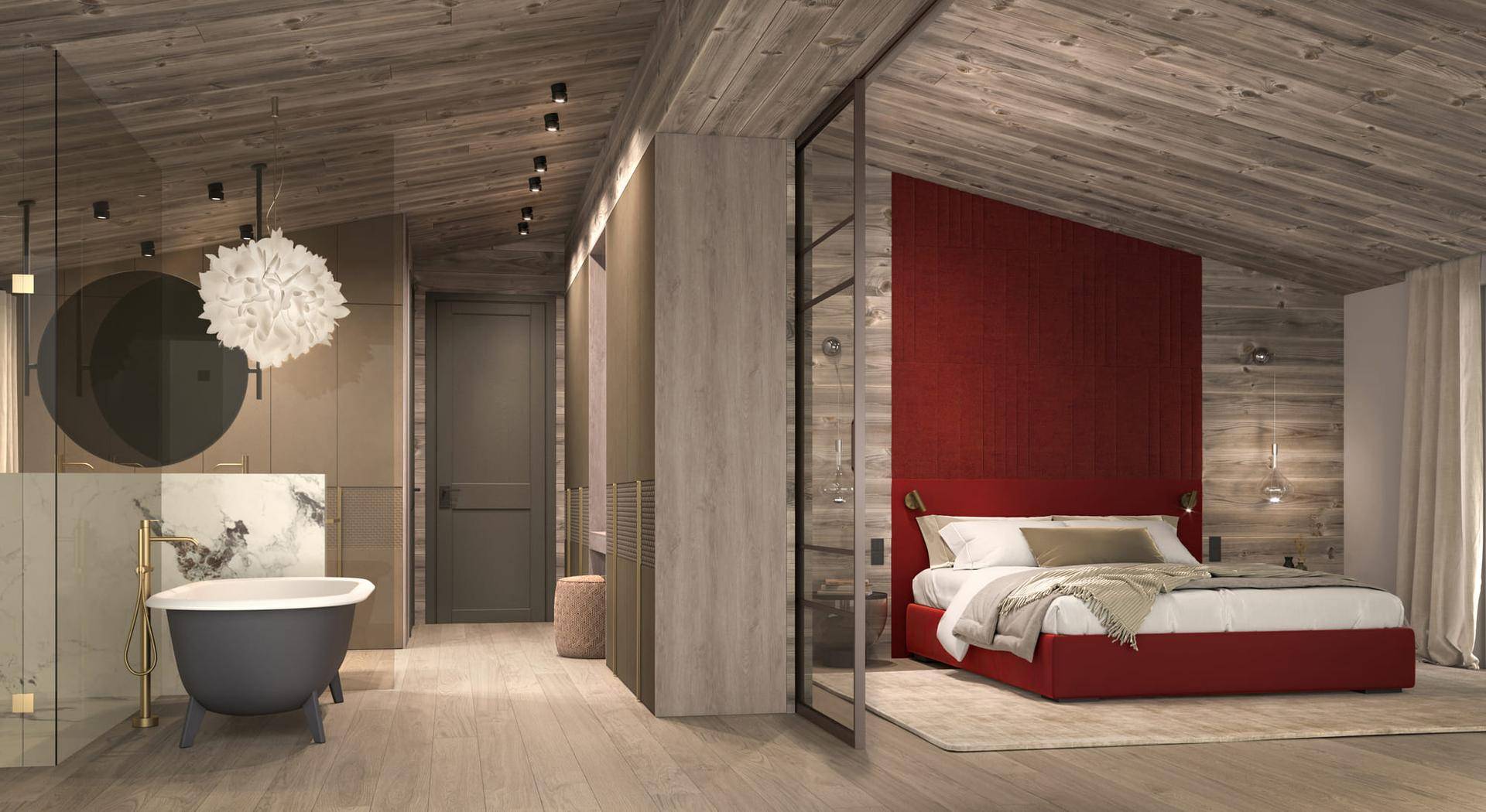 Schlafzimmer mit roter Akzentwand, Holzbalkendecke und offener Badewanne im Dachgeschoss.