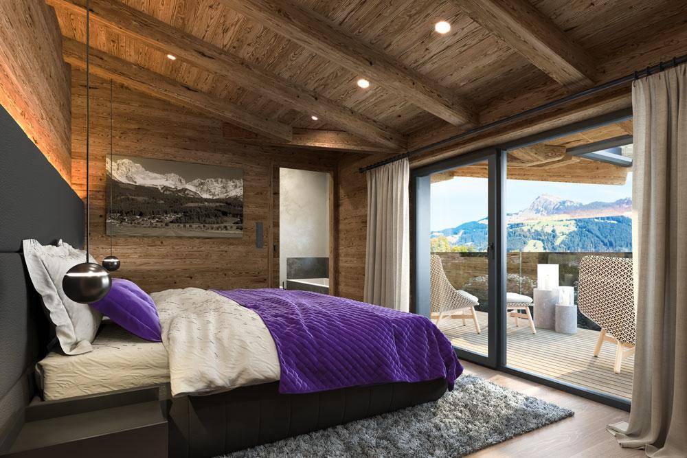 Gemütliches Schlafzimmer mit Holzausstattung, Zugang zum Balkon und Panoramablick auf die Berge.