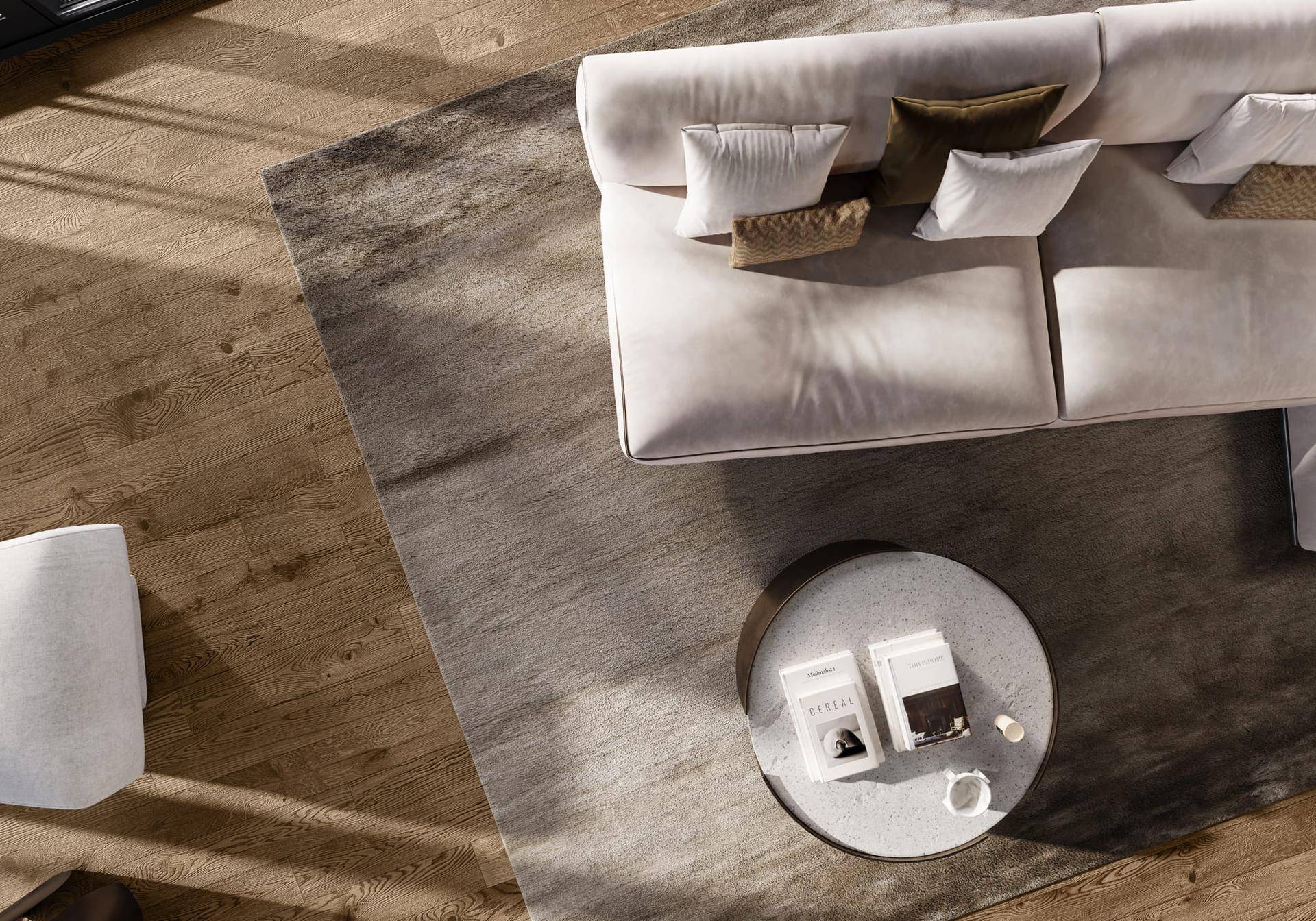 Detailansicht des Wohnzimmers mit hellem Sofa, weichem Teppich und elegantem Holzboden.