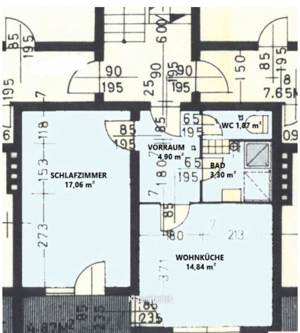 Grundriss einer Wohnung mit Schlafzimmer, offener Wohnküche, Badezimmer und separatem WC.