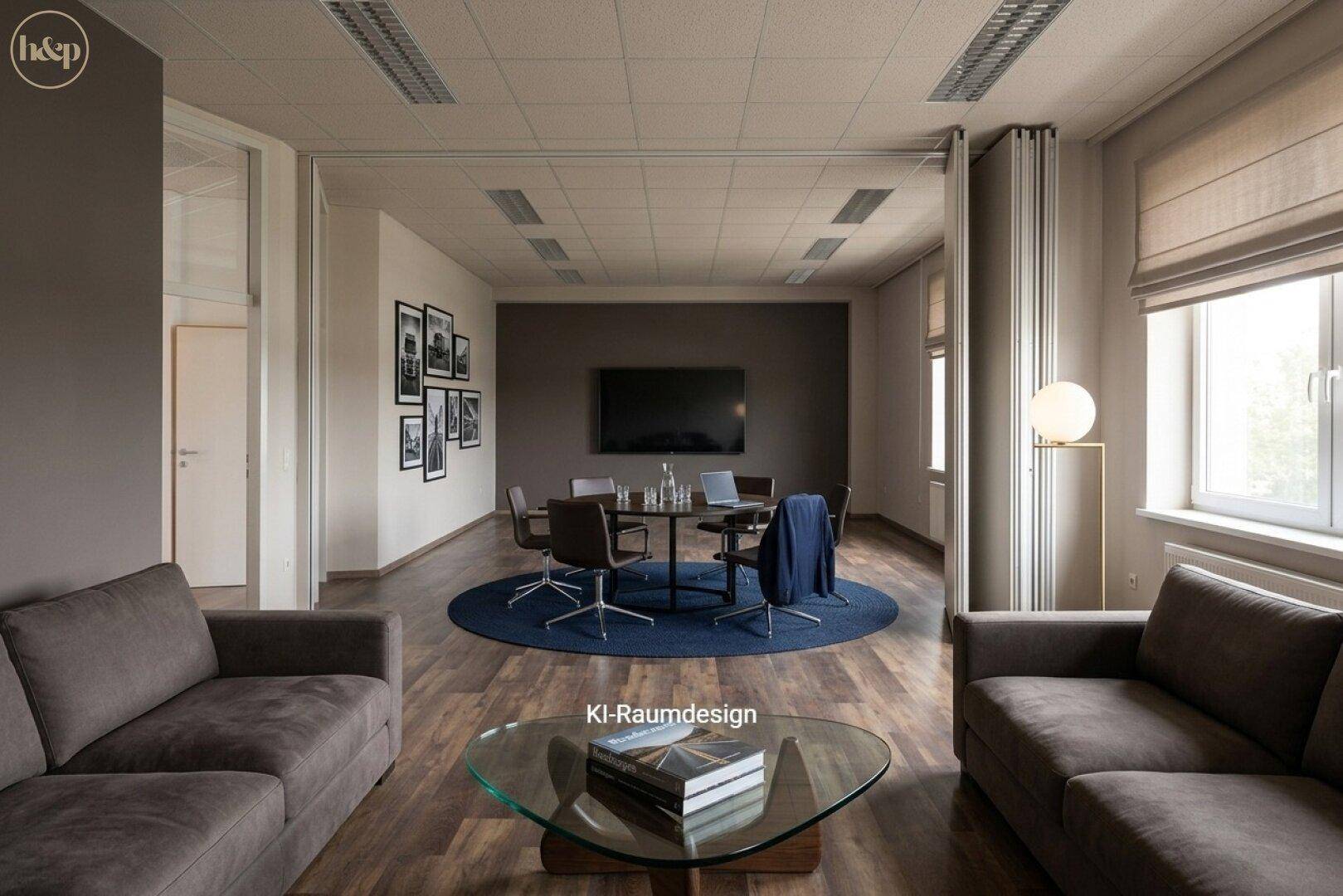 Gemütlicher Loungebereich mit Sofas, Glastisch und einem runden Besprechungstisch, ideal für informelle Treffen.