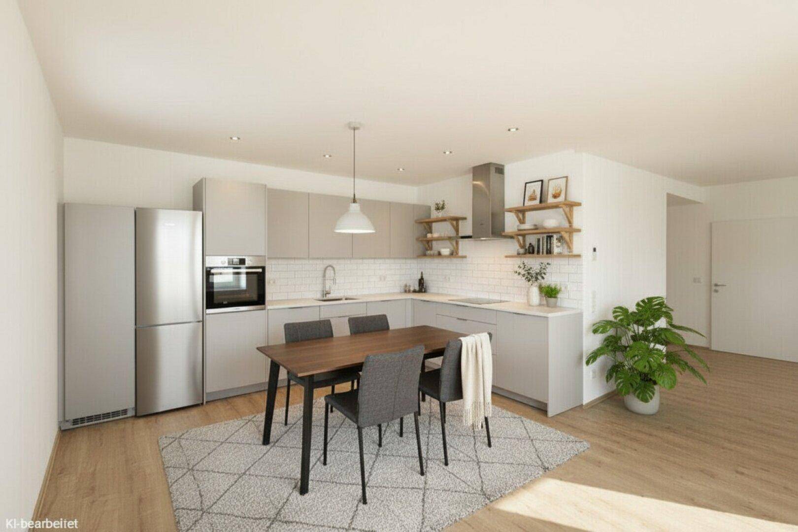 Moderne Einbauküche mit grauen Schränken, Essbereich und integrierten Geräten.