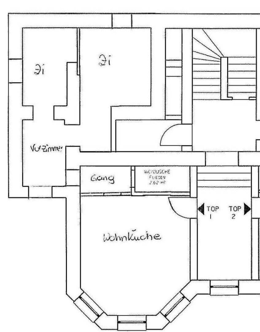 Grundrissplan zeigt die Aufteilung der Wohnung mit Wohnküche, Gang und Bad.