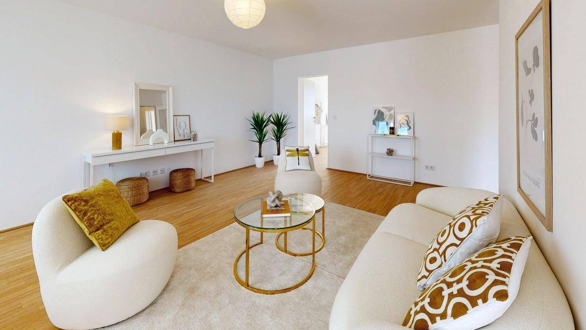 Gemütliches Wohnzimmer mit modernen Möbeln, Teppich und dekorativen Elementen.