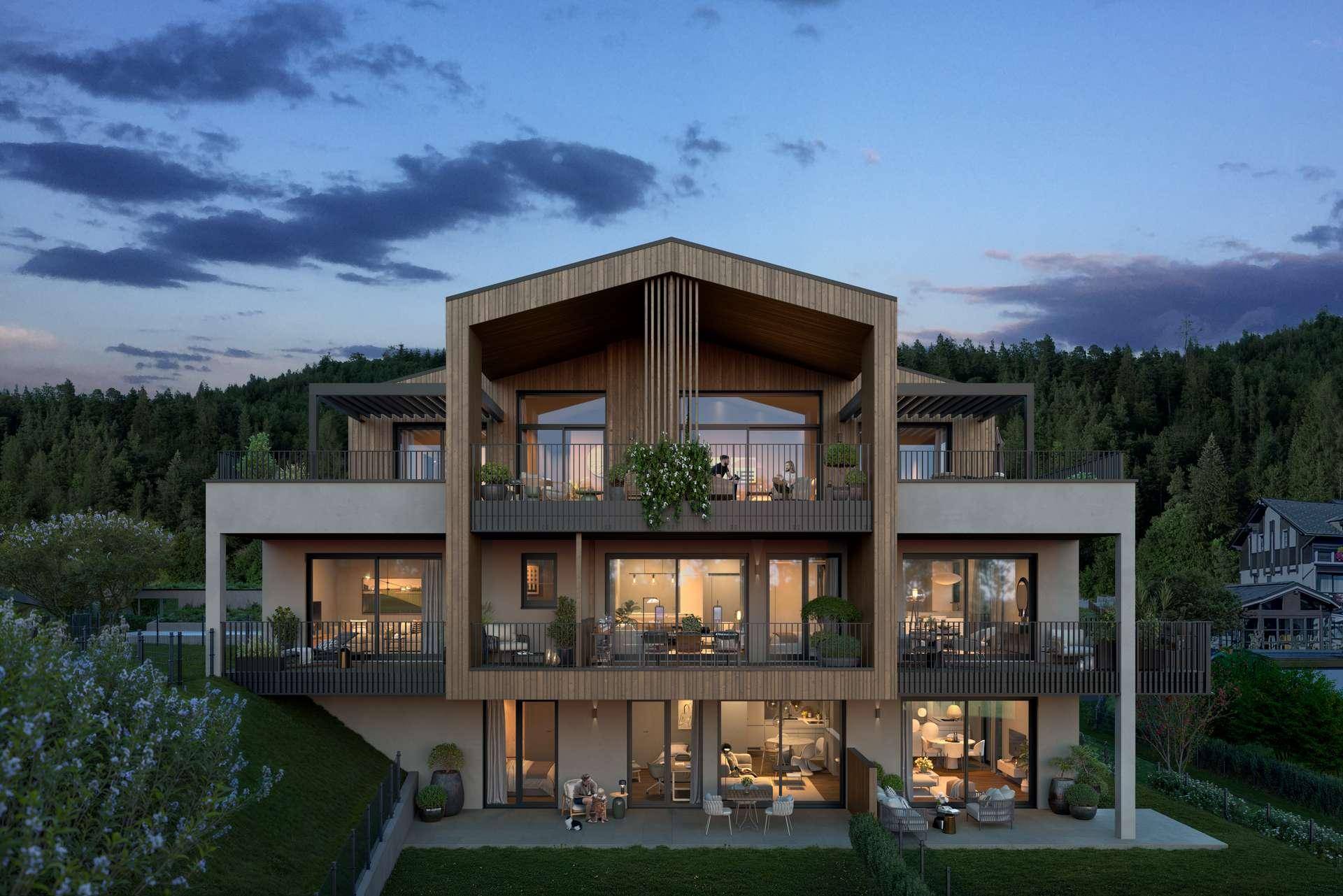 Architektonisch ansprechendes Gebäude mit Holzverkleidung, mehreren Balkonen und Terrassen am Hang.