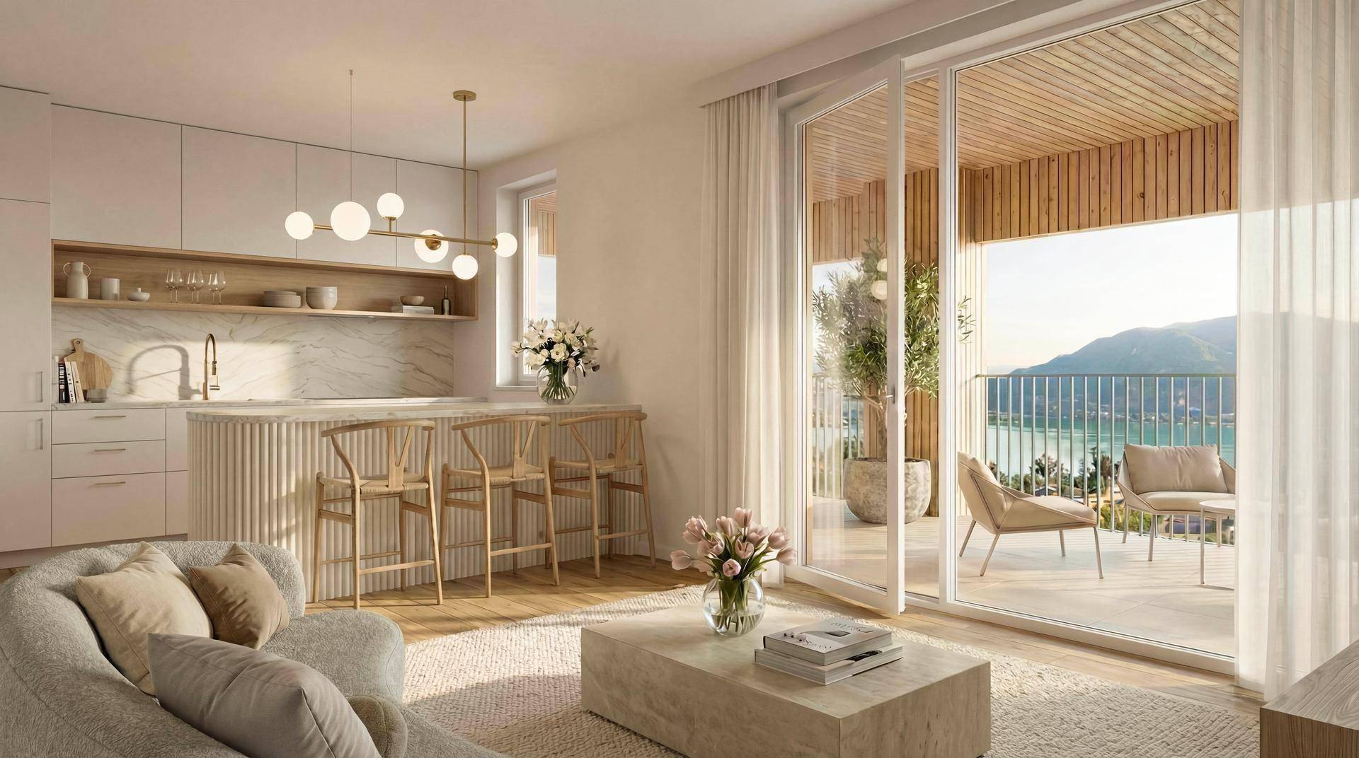 Heller offener Wohn- und Küchenbereich mit modernem Design und direktem Zugang zu einer Terrasse mit Seeblick.