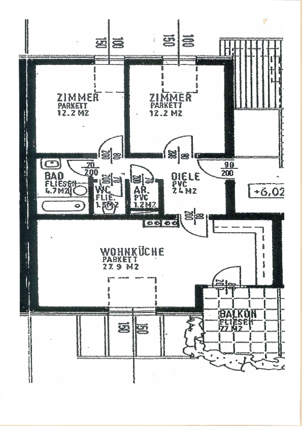 Grundriss einer Wohnung mit zwei Zimmern, Wohnküche, Bad und Balkon.
