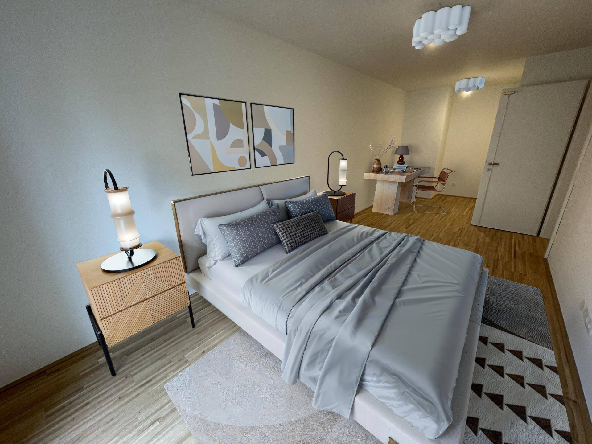 Gemütliches Schlafzimmer mit Doppelbett, Holzboden und einem kleinen Arbeitsbereich.