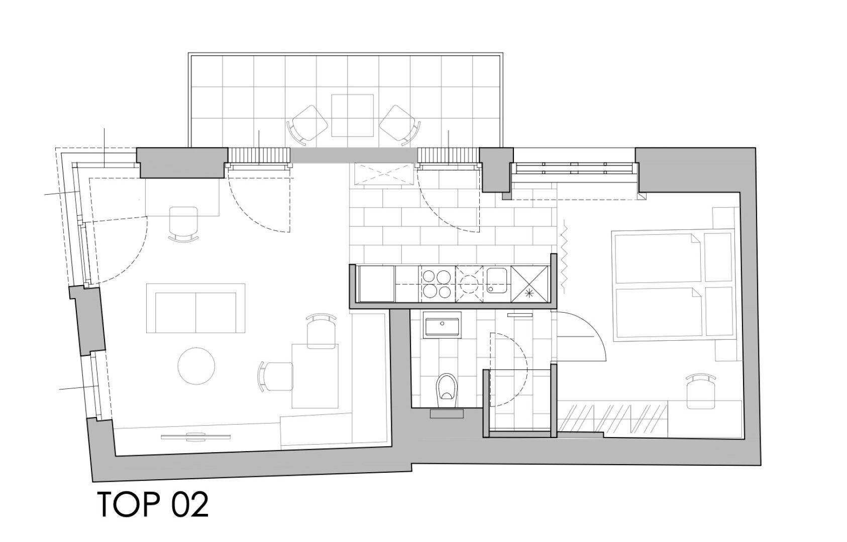 Grundriss einer Wohnung mit offenem Wohnbereich, Schlafzimmer und Terrasse.