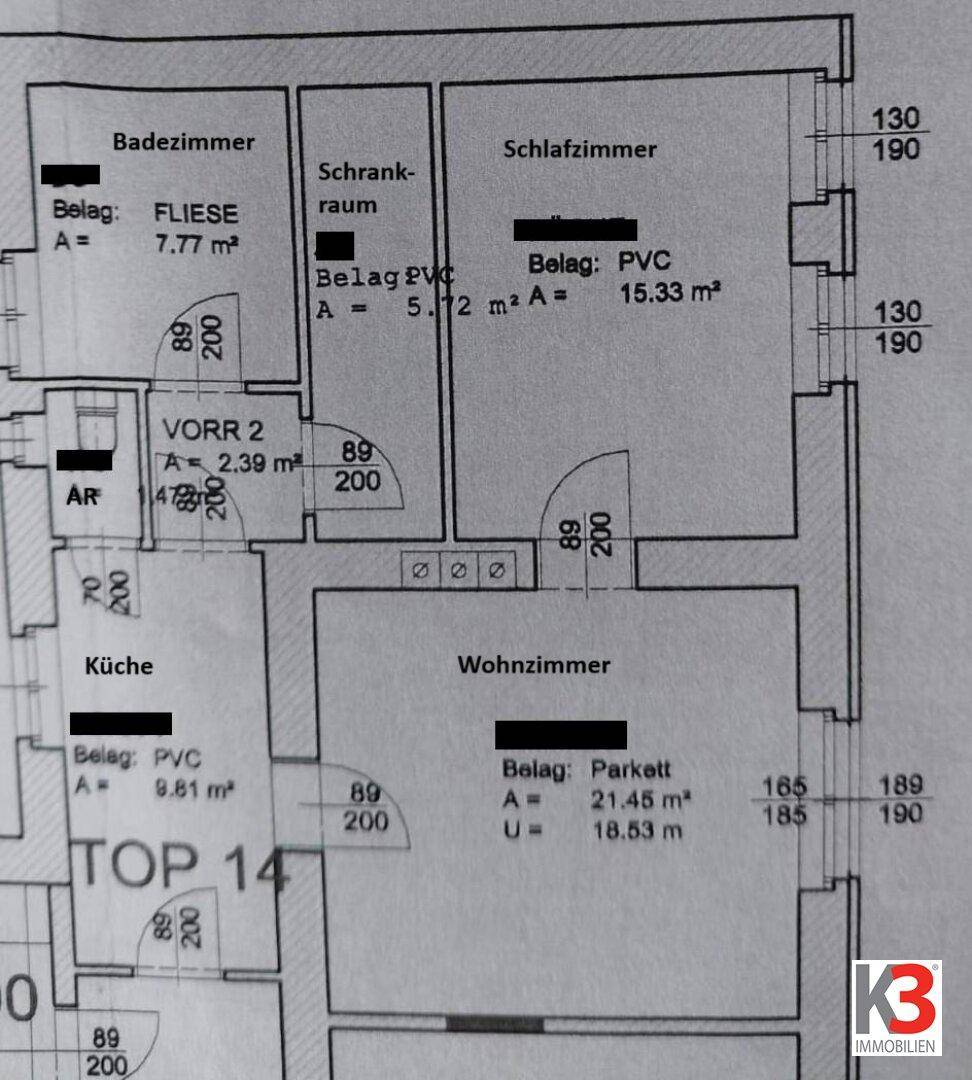 Grundriss einer Wohnung mit Schlafzimmer, Wohnzimmer, Küche und Bad.