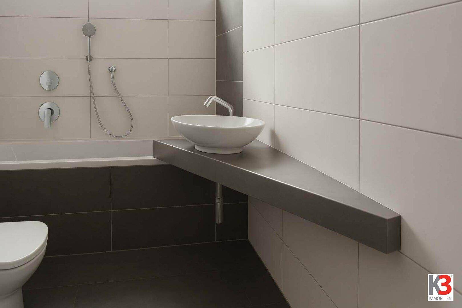Detailansicht des modernen Badezimmers mit stilvollem Aufsatzwaschbecken und schwebender Ablagefläche.